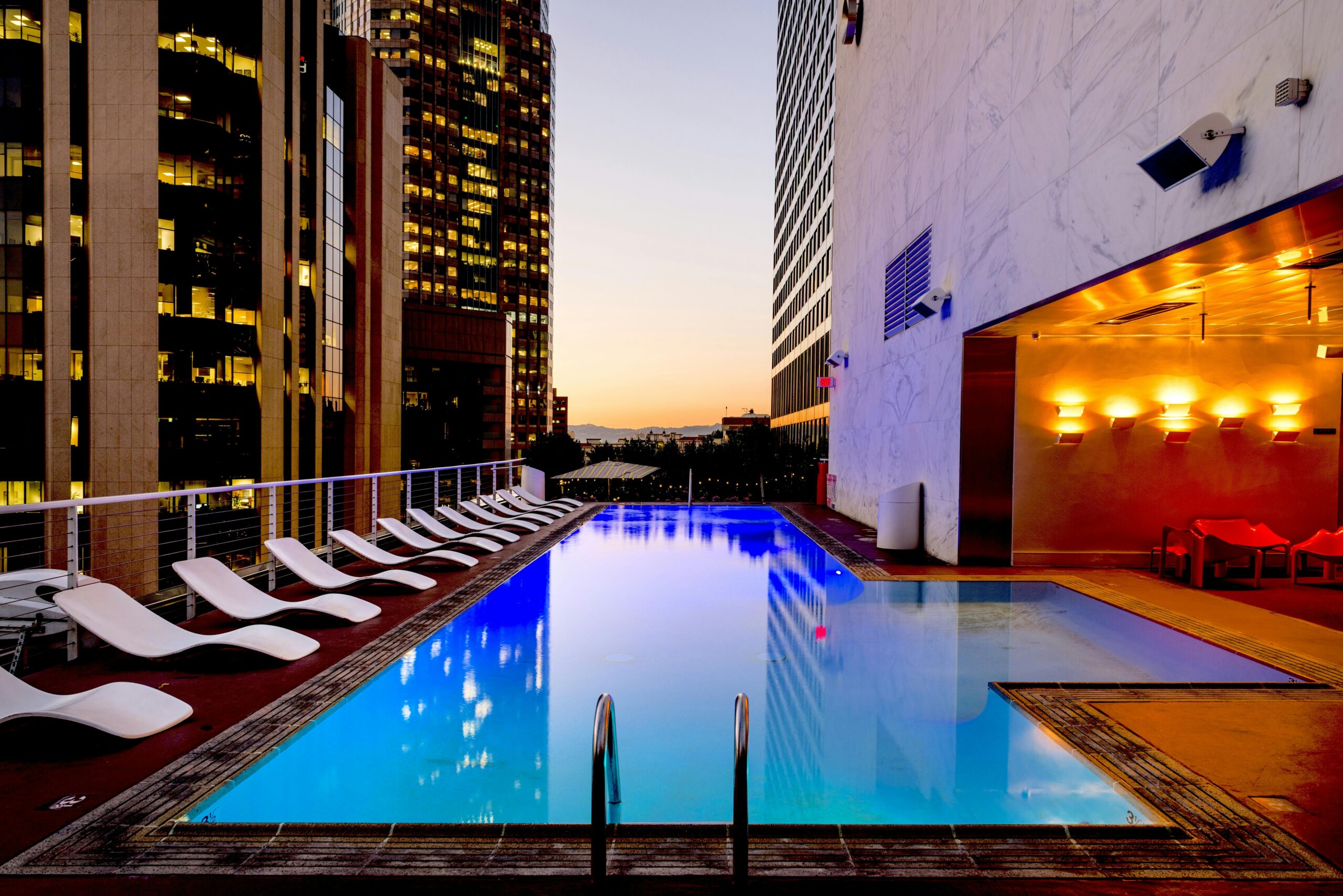 custom swimming pool contractor, overflow swimming pool with channels at dubai villa