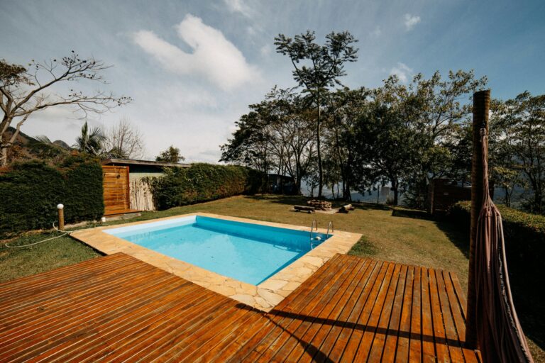 The Timeless Appeal and Modern Benefits of Wooden Decking Around Your Pool